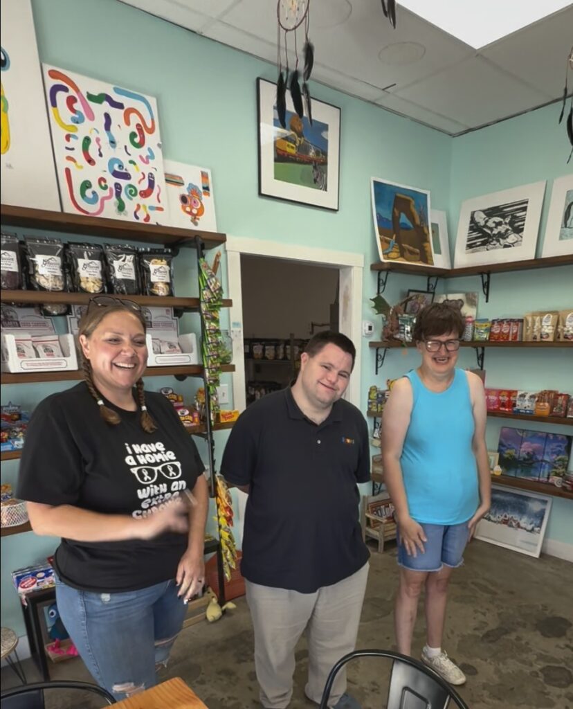 john, Cyndy and Amy standing inside Sweet Zola's Candy Shop