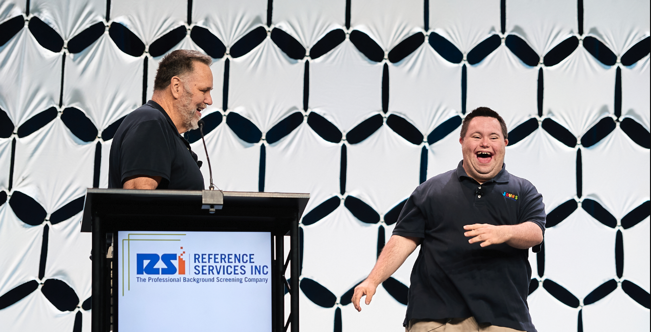 John and Mark Cronin connecting with an audience during a keynote presentation